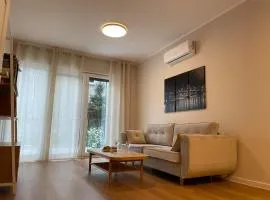 Modern terraced apartment with green garden