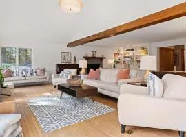 Bright 2BR Cabin with Sunroom Firepit Near Trails