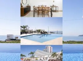 Apto Vista Mar Home Club Pé na Areia 3 Quartos Ares Condicionados Cozinha Completa Piscina Aquecida Jacuzzi Sauna Academia Quadra Playground Salão de Jogos 15min do Beto Carrero