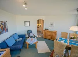 Inselblume 14 - Blaue Ferienwohnung mit Balkon am Südstrand