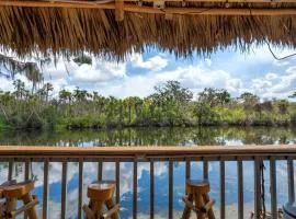 Riverside Hut Cozy Getaway w Tiki Hut & Grill