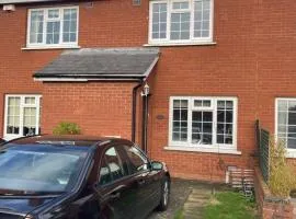 Entire Terraced two story redbrick house with parking in secluded cul de sac