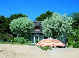 Holiday apartment in a thatched house by the beach
