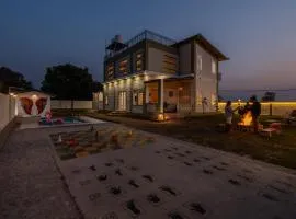 SaffronStays Sher Bagh - 4BR eco-friendly pool villa with jungle trails, farm-to-table meals & bonfire nights near Corbett Park