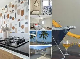 Cantinho Perfeito para Dois Conforto e Mar Bem Pertinho, Casa terrea no centro 80M Praia, Ar, Enxoval,Estacionamento e churrasqueira