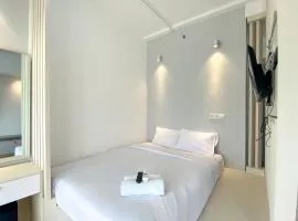 Homey and Elegant Studio Vasanta Innopark Apartment By Travelio