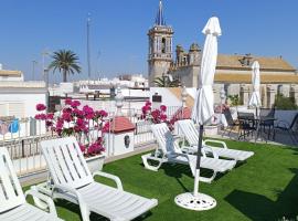 Apartamentos turísticos CASA de los BALCONES, хотел в Чипиона