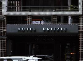 Drizzle Inn, hotel v destinaci Ťi-lung