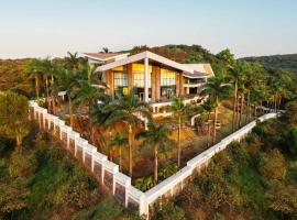 StayVista's Emerald Acres offering a heated pool, bonfire, snooker table, scenic views, tennis court, steam room, gazebo, & gym, hotel in Lonavala