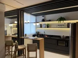 Apartamento com suíte e varanda no centro