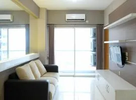 Homey 2BR at Puncak Bukit Golf Surabaya Apartment By Travelio