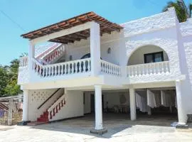 Fully furnished 2 bedroom villa in Nyali with swimming pool all en-suite 3 minutes walking distance to the beach behind city mall