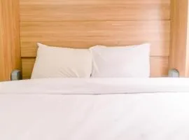 Elegant and Tidy 2BR Green Pramuka City Apartment near Mall By Travelio