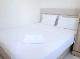 Modern and Homey 2BR at Puncak Kertajaya Apartment By Travelio