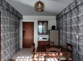 Apto central com estacionamento