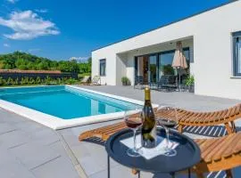 Villa The Pool House, a lush modern villa with a pool