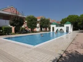 Spacious apartment with terrace and pool in Bibione