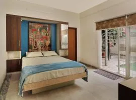 Prutha's Nest Room 1 - opening to vibrant garden