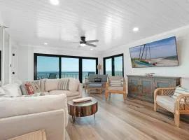 Large balcony with direct oceanfront views and access to complex pool