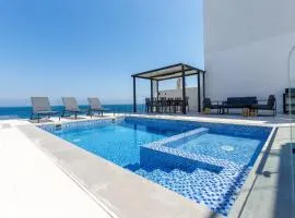 Sea-Facing 4BR Villa with Two Assistant Room, Heated Pool and Barbecue Space, Al Dana Island, Fujairah by Deluxe Holiday Homes