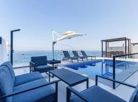 Overlooking Pool, Mountain and Sea 6BR Villa with Two Assistant Room, Heated Pool, BBQ Area, Al Dana Island, Fujairah by Deluxe Holiday Homes
