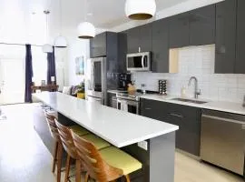 Upscale 2BR Condo w Patio City Views Walk to DT