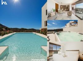 Modern penthouse with two terraces, jacuzzi and sea, lake and mountain views, in Almazara Hills, hotel en Istán