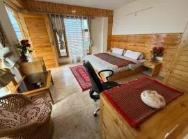 Luxury 1 BHK Apartment for Rent in Naggar,Manali with Modern Kitchen, Wooden Interior, and Spacious Bathroom