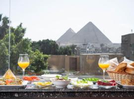 Naktsmītne pie ģimenes Quantum Pyramids View INN Kairā