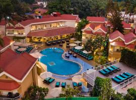 Whispering Palms Beach Resort, hotel in Candolim