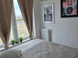 Apartament Słoneczny Taras przy Aquapark Reda、ルミアのキッチン付きホテル