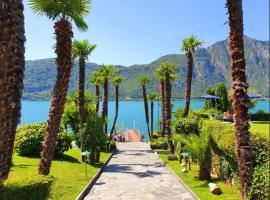 Apartment direkt am Luganersee, hotel na praia em Bissone