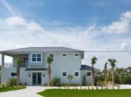 Riverfront Oasis with Ocean Views Steps from Car Free Beach 6090T