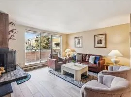 Riverside Condo, with a Pool & Hot Tub - Steps to Town