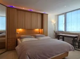 Bright room with private bathroom and market square view