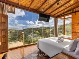 Encantadora cabaña vista en las montañas VST005