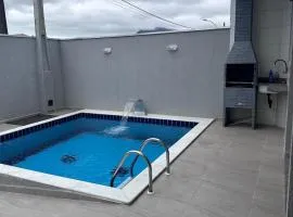 Casa com piscina em Peruíbe