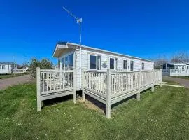 Beautiful Caravan With Decking At California Cliffs In Scratby Ref 50052L