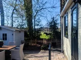 Hotel chique chalet met zicht over de weilanden op de Veluwe