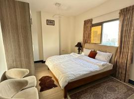 1-Bedroom Family Apartment with Balcony in Sharjah、シャルジャのキッチン付きホテル