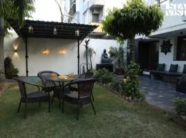 StayVista at House of Palm with Bonfire & Pool