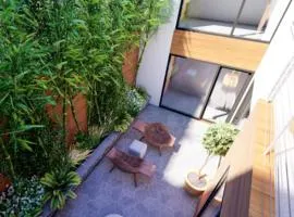 Piso con dos habitaciones con camas dobles y terrazas en el Poblenou