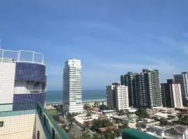 Aconchego no Canto do Forte - Ar Condicionados - Tvs Grandes - Wi-fi e Estacionamento Incluso!