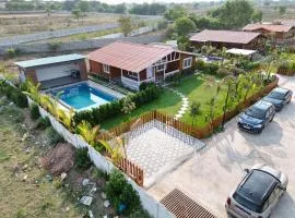 Kuku farm stay 3 bedroom wooden cottage with private pool at Moinabad