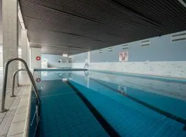 Apartment Cosy @ the beach studio with pool by Interhome