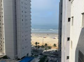 Apartamento com vista lateral da praia, hotel en Praia Grande