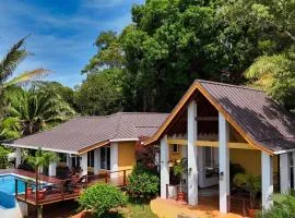 Relax At This Hillside Retreat That Overlooks The Lush Forest And The Caribbean,