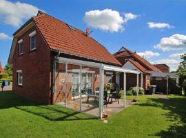 ruhig aber zentral gelegene Ferienwohnung im Erdgeschoß, hotel in Dornum