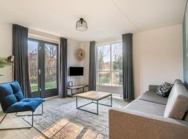 Zeer comfortabel vakantiehuis op kleinschalig park 6 personen, hotel in Ewijk