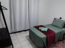 Quarto em casa de família